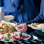 Guests helping themselves to a buffet